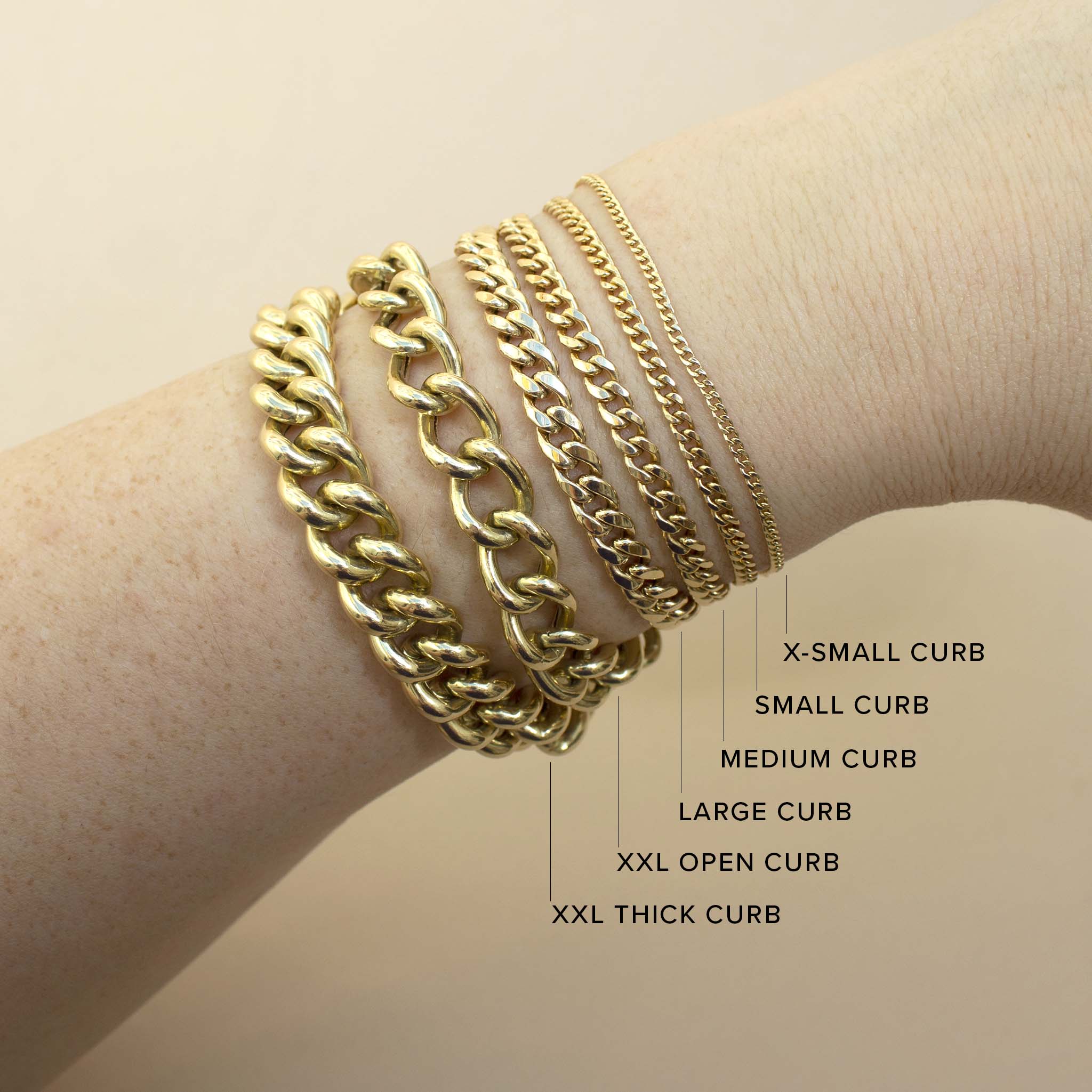 An image of six different widths of Zoë Chicco 14k gold curb chain bracelets stacked together to show a comparison of size