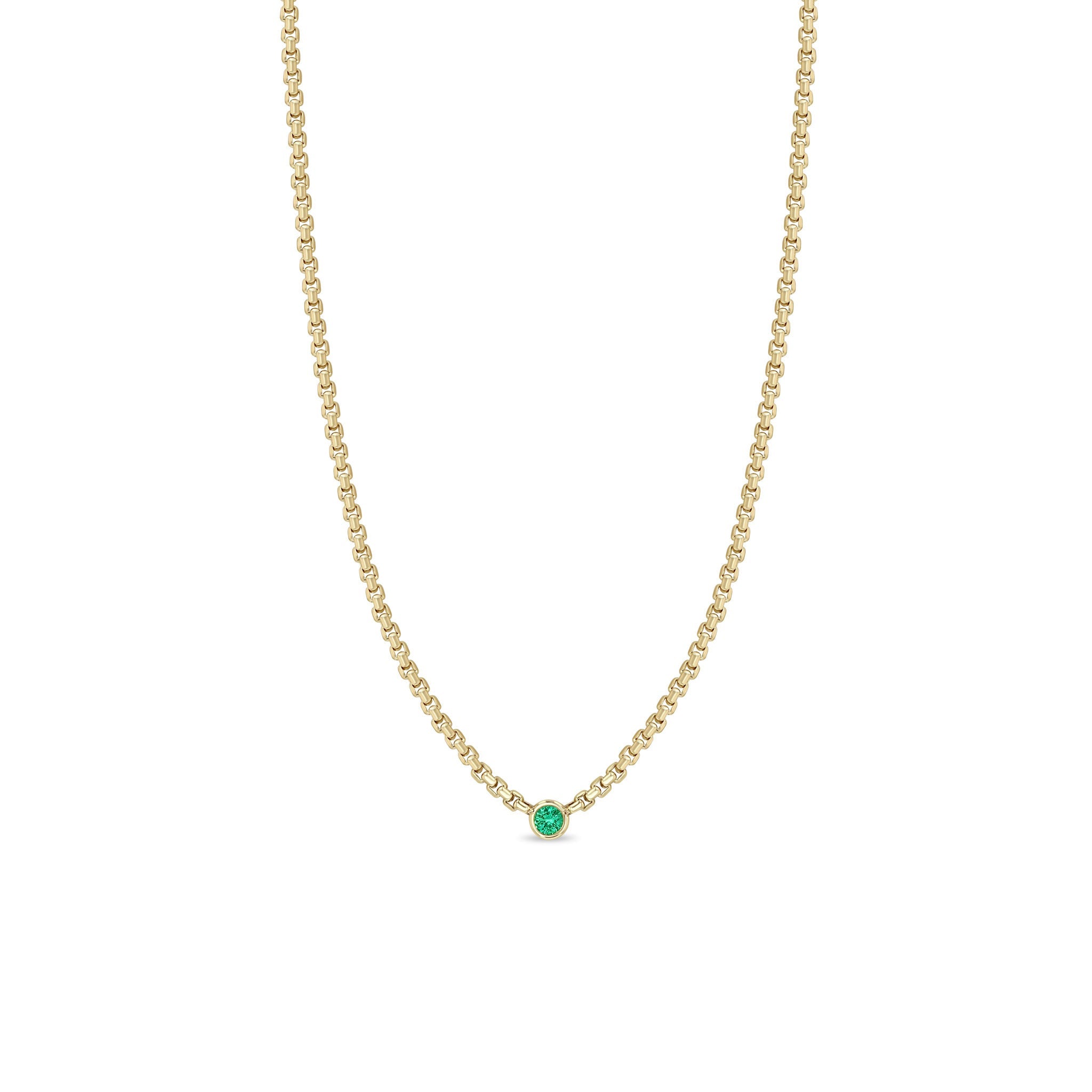 Zoe Chicco 14k gold chain necklace with a small round emerald gemstone in the center on a white background