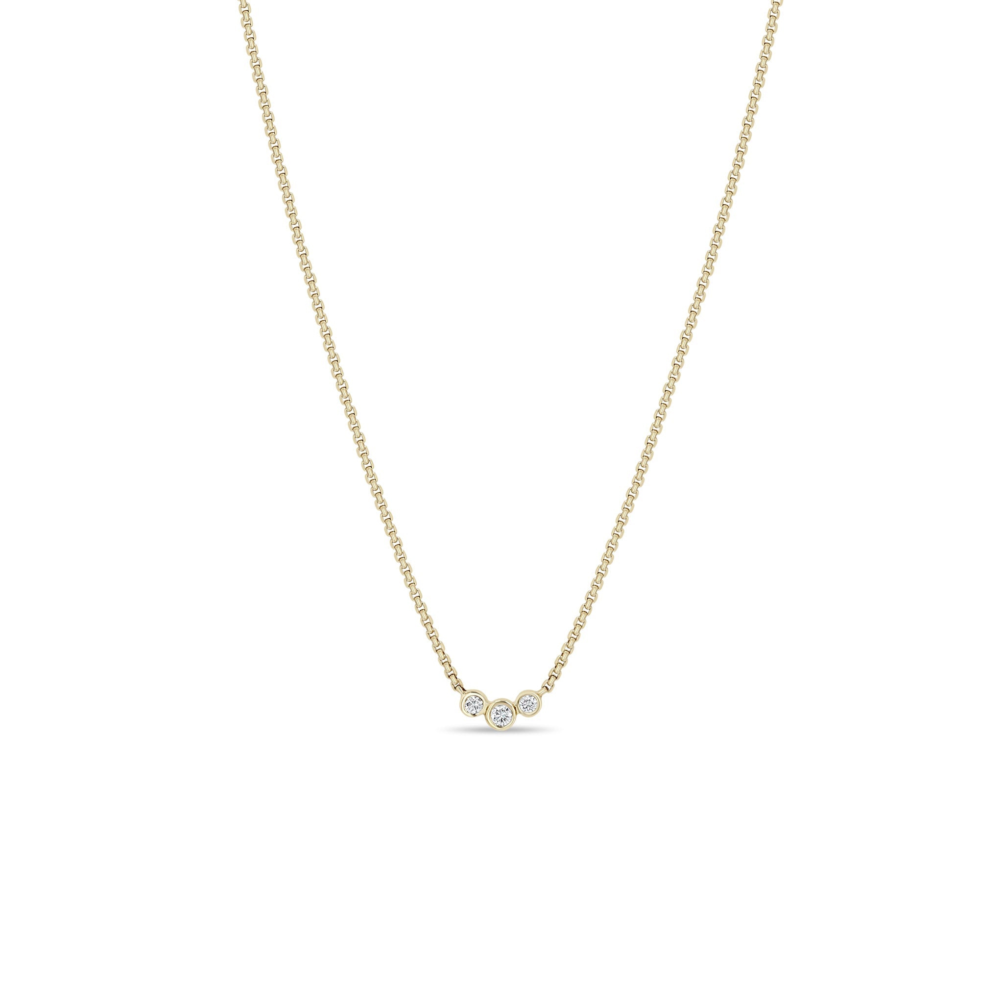 Zoe Chicco 14k gold chain necklace with 3 small diamonds in the middle on a white background