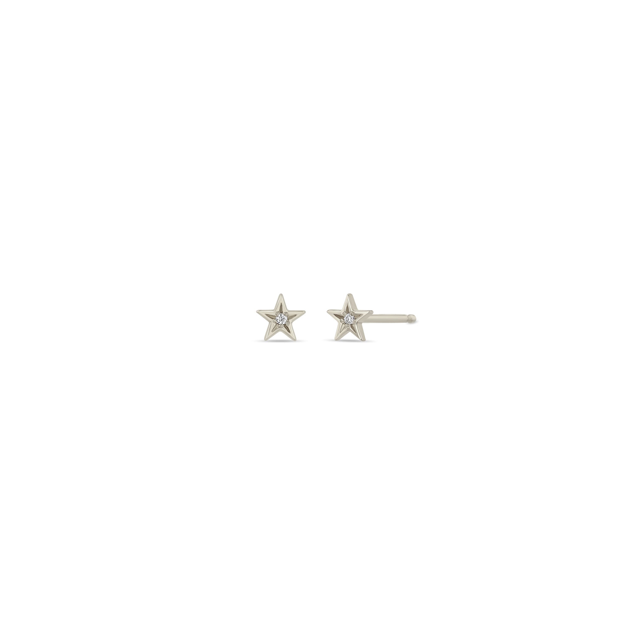 Zoe Chicco 14k white gold itty bitty star studs with star set diamonds in the center on a white background