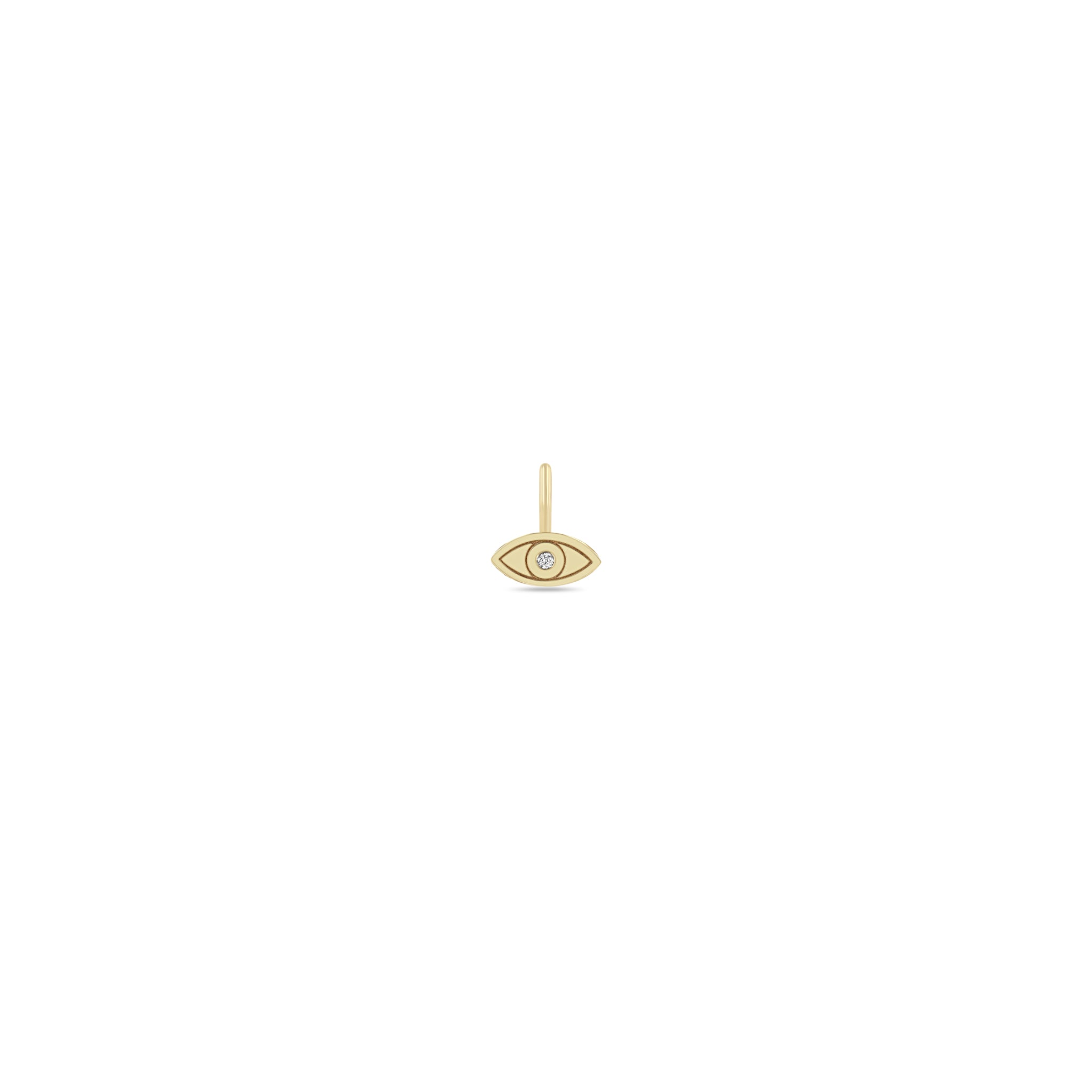 Zoe Chicco 14k gold evil eye charm with a single diamond in the center on a white background