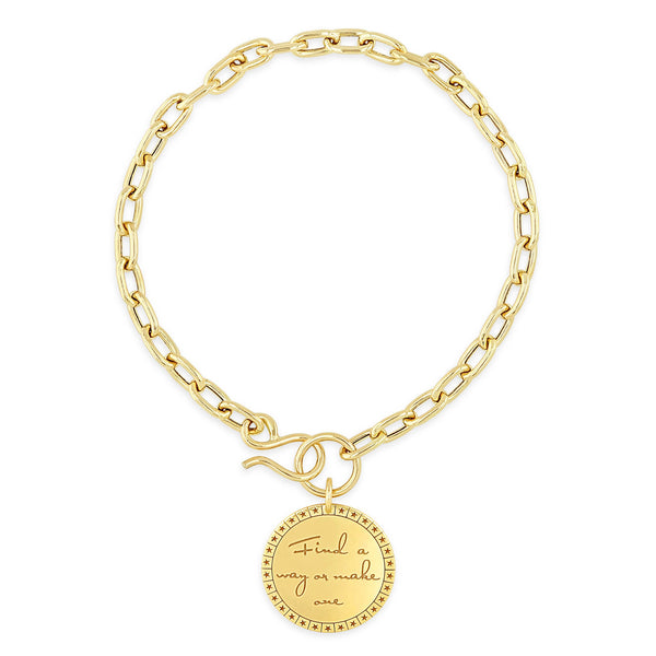 top down view of a Zoë Chicco 14k Gold Medium Mantra Charm Oval Link Chain Hook Bracelet engraved with "Find a way or make one"