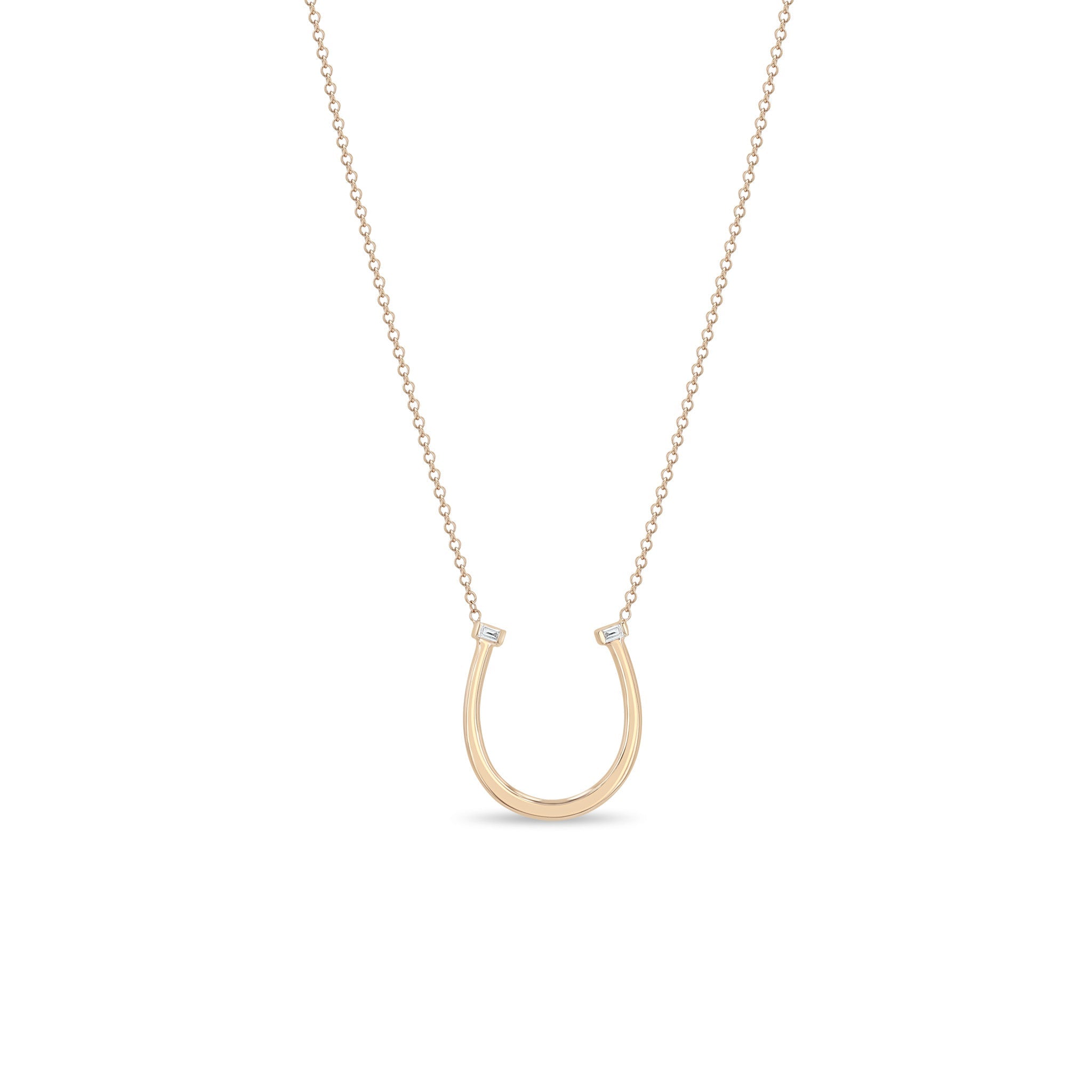 Zoe Chicco 14k rose gold chain necklace with horseshoe pendant and two small baguette diamonds on a white background