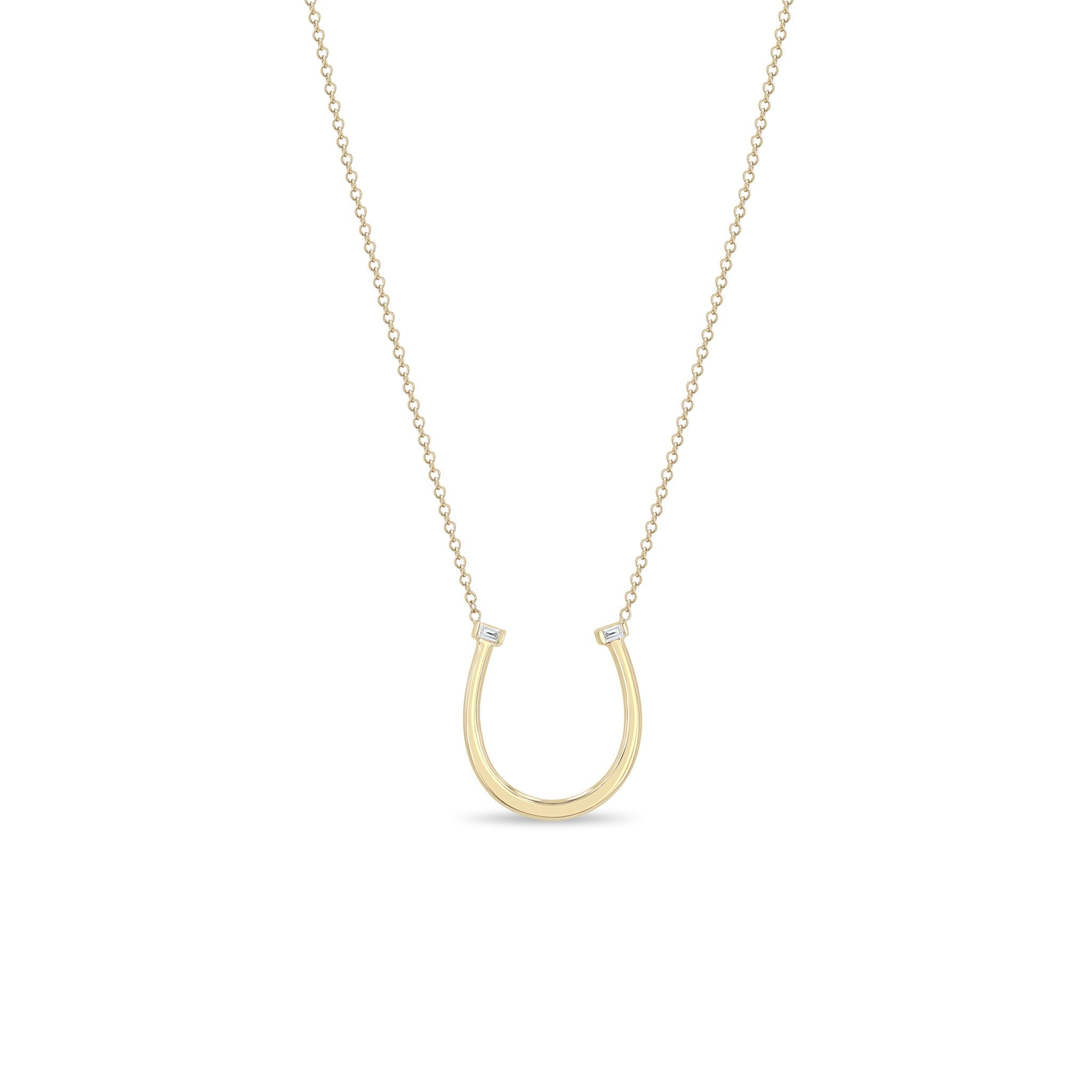 Zoe Chicco 14k gold chain necklace with thin horseshoe shaped pendant with two small baguette diamonds on a white background