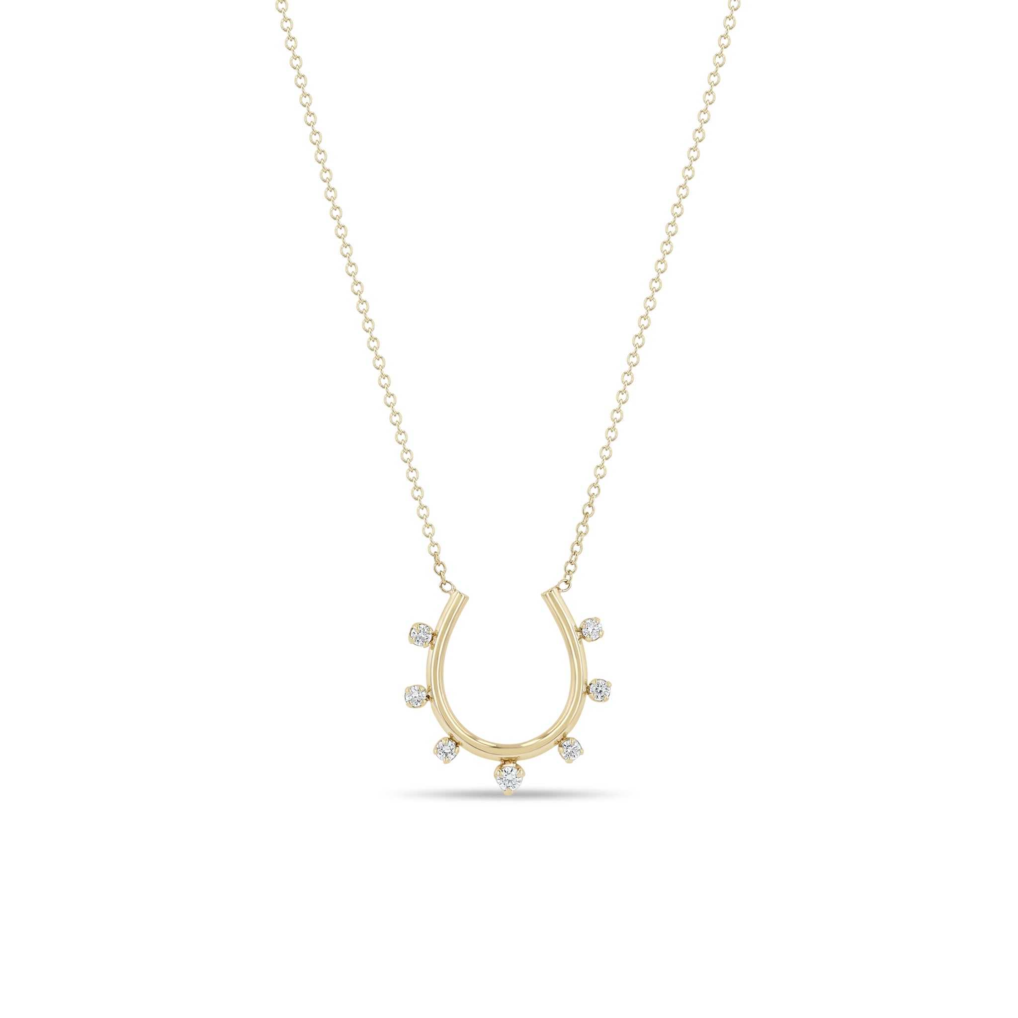Zoe Chicco 14k gold horseshoe pendant necklace with small prong diamonds on a white background