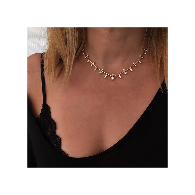 woman in a black top wearing a Zoë Chicco 14k Gold Paris Mixed Stacked Diamond Collar Necklace