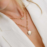 woman in a white blazer wearing a Zoë Chicco 14k Gold One of a Kind 2.26 ctw Rose Cut Oval Diamond on Large Square Oval Chain Necklace layered with a aura pendant necklace