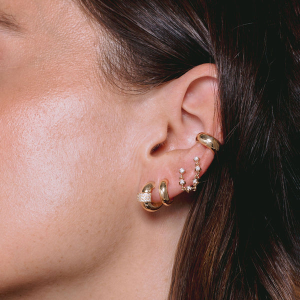 close up of woman's ear wearing Zoë Chicco 14k Gold 6 Linked Prong Diamond Chain Double Stud Earring