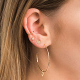 woman's ear wearing Zoe Chicco 14kt Gold Thick Plain Ear Cuff