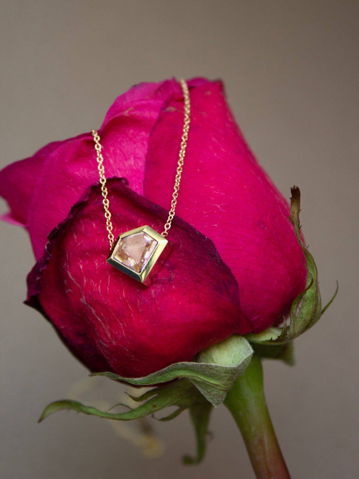 woman wearing five 14k gold and diamond Zoë Chicco necklaces layered together