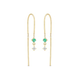 Zoe Chicco 14k gold wire dangle earrings with a white diamond and emerald on a white background