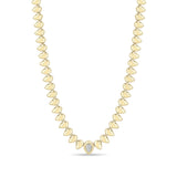 Zoe Chicco 14k gold teardrop shaped bead necklace with a single pear diamond on a white background