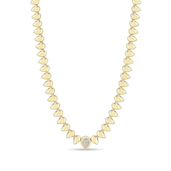 Zoe Chicco 14k gold teardrop shaped bead necklace with a single pear diamond on a white background