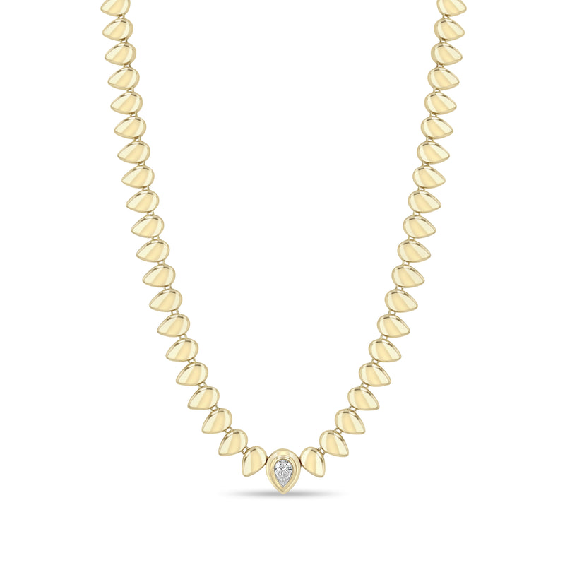 Zoe Chicco 14k gold teardrop shaped bead necklace with a single pear diamond on a white background