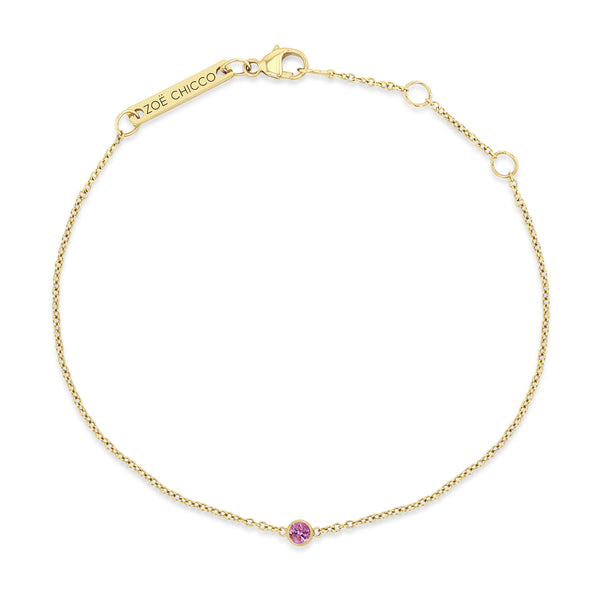 Top down view of a Zoë Chicco 14k Gold Single Pink Sapphire Bezel Bracelet