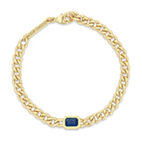 top down view of a Zoë Chicco 14k Gold Medium Curb Chain Emerald Cut Blue Sapphire Bezel Bracelet
