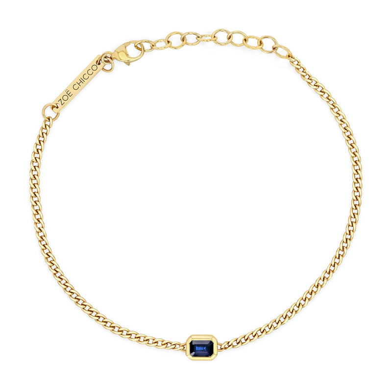 top down view of a Zoë Chicco 14k Gold Emerald Cut Blue Sapphire XS Curb Chain Bracelet