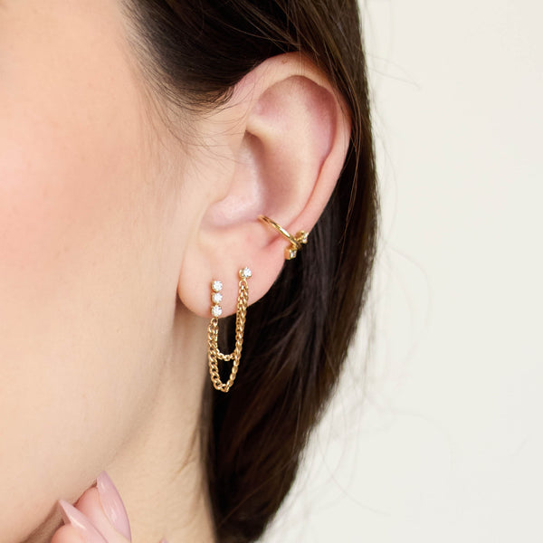 Zoe Chicco 14K woman wearing gold chain and diamond earrings