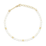 top down view of a Zoë Chicco 14k Gold Bead Station Rice Pearl Bracelet