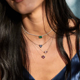 a woman in a navy camisole wearing a Zoë Chicco 14k Gold One of a Kind 1.38 ctw Shield Pink Sapphire Bezel Necklace layered with a 1.16 ctw Marquise Pink Sapphire with Floating Diamond Stations Necklace and two other one of a kind gemstone necklaces