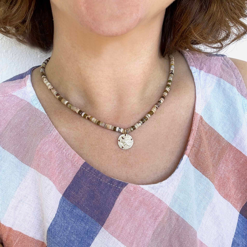 Zoe Chicco's 14k Gold & Sandy Feldspar Mixed Heishi Bead Sand Dollar Charm Necklace shown on model