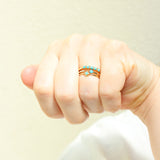 a woman's hand making a fist wearing a Zoë Chicco 14k Gold Prong Turquoise & Pavé Diamond Open Ring on her ring finger