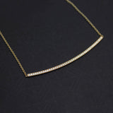 14k Pavé Diamond Long Curved Bar Necklace on a black background