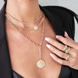 close up of a woman in a black blazer wearing a Zoë Chicco 14k Gold Large Compass Medallion Adjustable XL Square Oval Chain Necklace