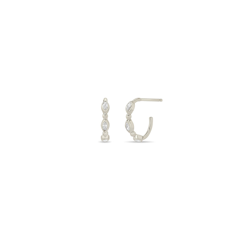 Pair of Zoe Chicco 14k white gold hoop earrings with small diamonds on a white background
