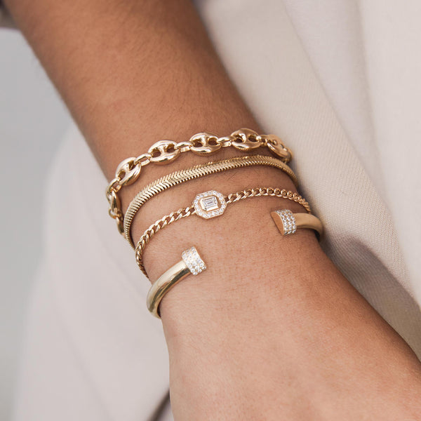 wrist with stacking bracelets including 14k Gold Large Puffer Mariner Chain Bracelet
