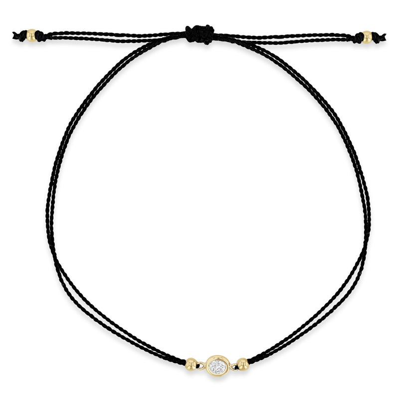 top down view of a Zoë Chicco 14k Gold Floating Diamond Solitaire Cord Bracelet