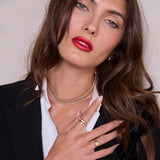 woman in a black blazer wearing a Zoë Chicco 14k Gold Diamond Tennis Double Wide Curb Chain Necklace 