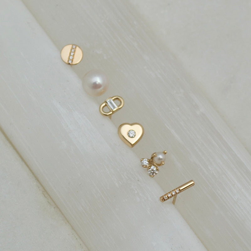 a variety of Zoe Chicco studs including: 14k Baguette Diamond Open Link Studs, 14k Diamond Nugget Heart Studs, 14k Mixed Prong Diamond & Pearl Cluster Stud Earrings, 14k Offset Pavé Diamond Bar Studs