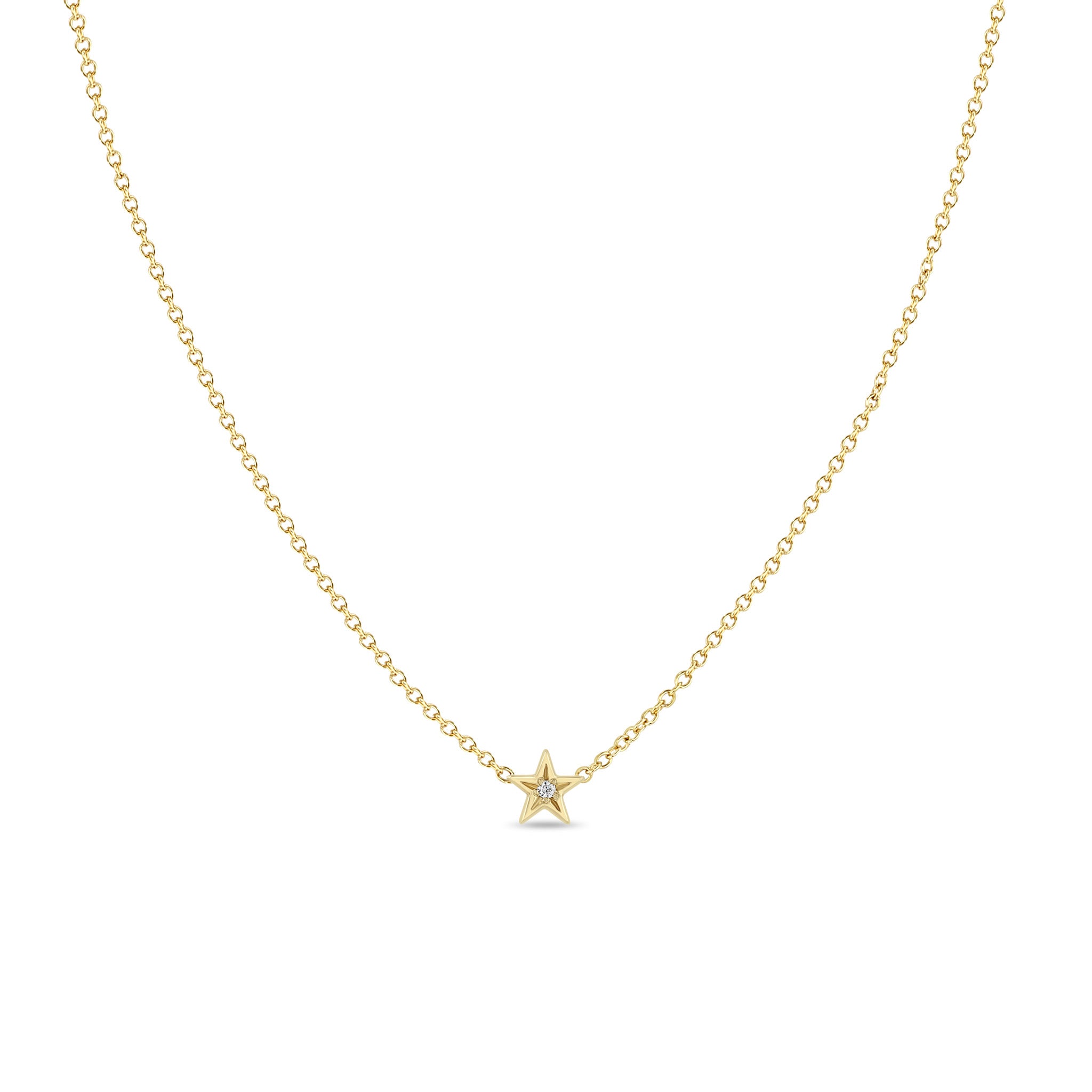 Zoe Chicco 14k gold itty bitty star necklace with a star set diamond in the center on a white background 