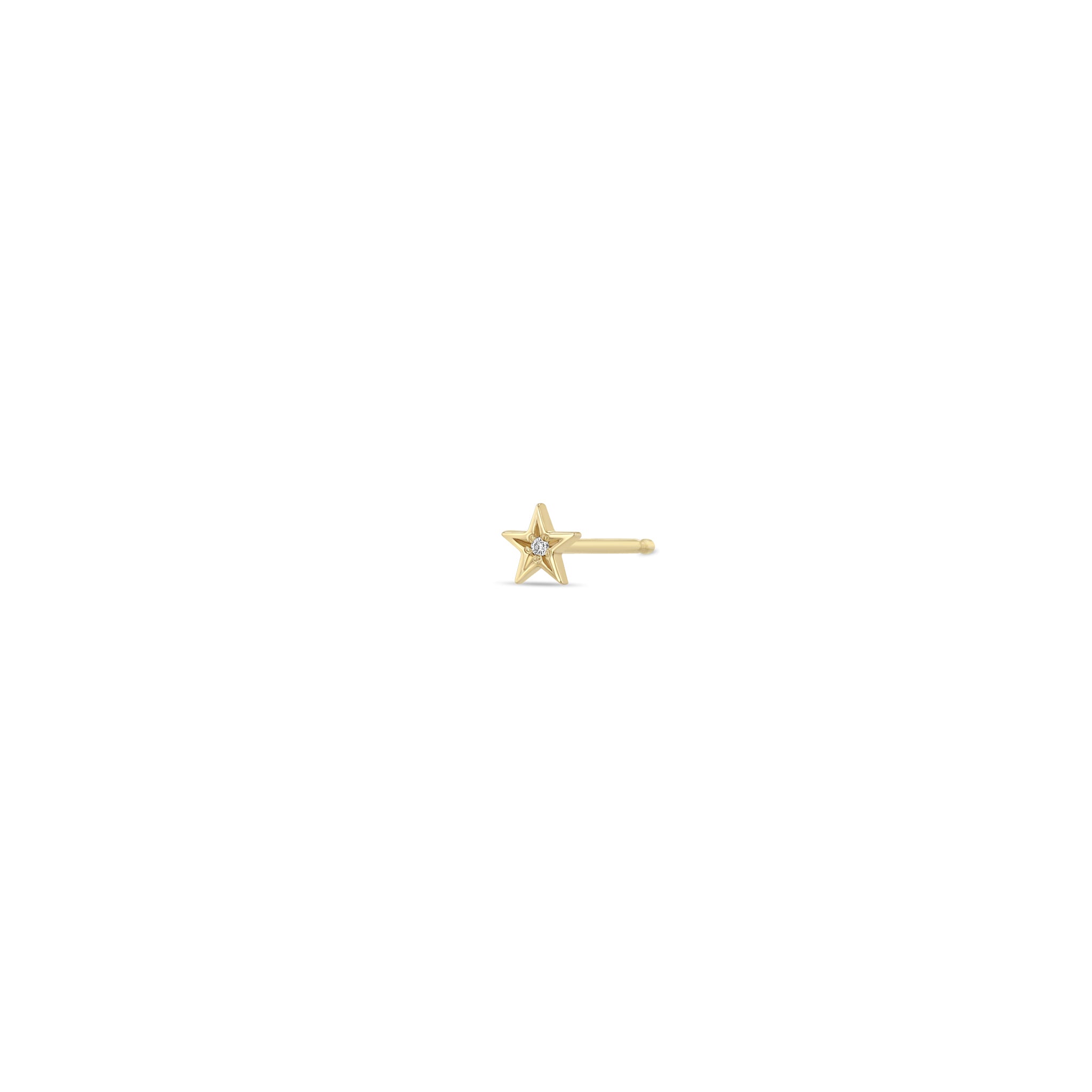 Zoe Chicco 14k gold itty bitty star studs with star set diamond in the center on a white background
