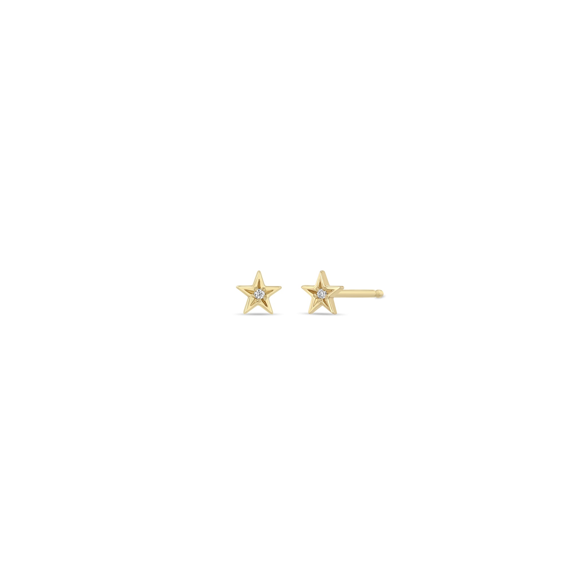 Zoe Chicco 14k gold itty bitty star studs with star set diamonds in the center on a white background