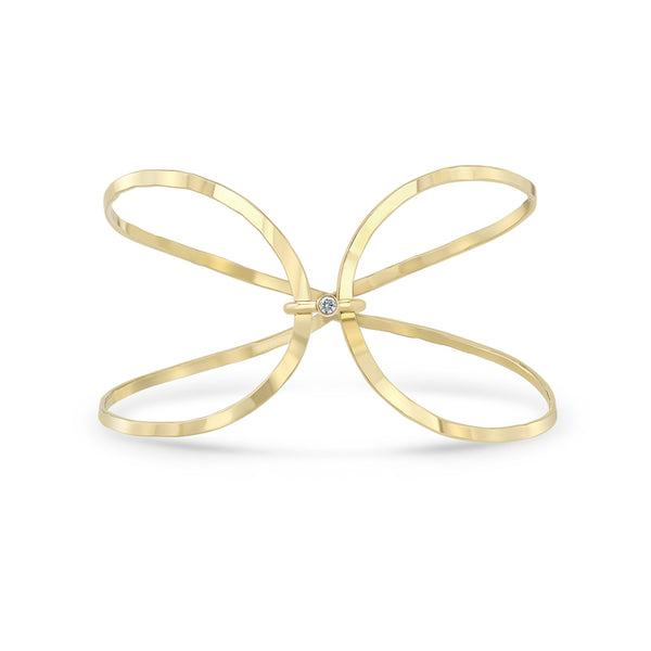 Zoe Chicco 14k gold infinity shaped wire cuff bracelet with single diamond on white background