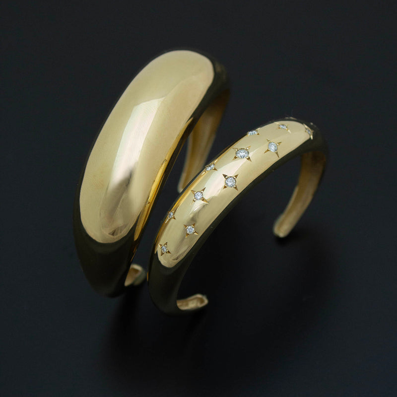 14k large Aura Cuff and 14k Scattered Star Set Diamonds Medium Aura Cuff  on a black background.