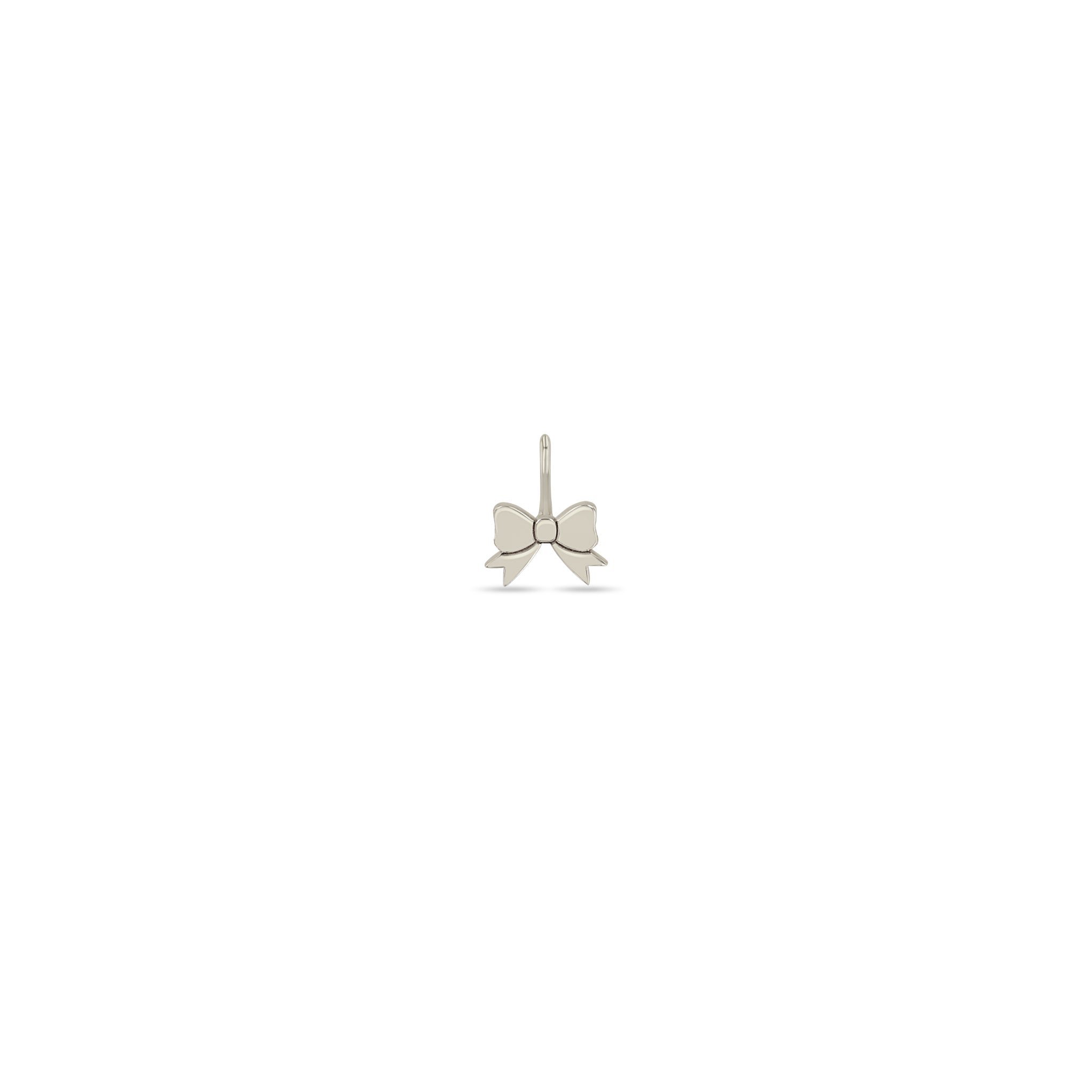 Zoe Chicco 14k white gold midi bitty bow charm on a white background