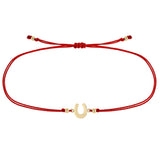 Zoe Chicco 14k gold horseshoe charm red cord bracelet on a white background