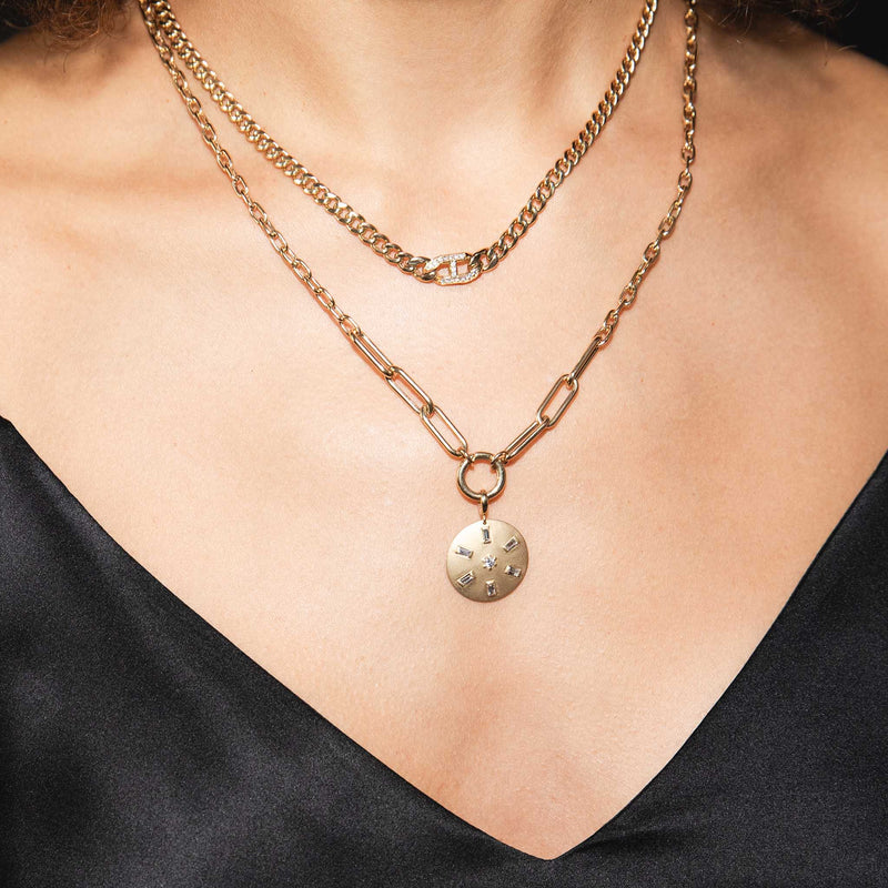 A Zoe Chicco necklace stack including a Pave diamond Mariner Link Necklace and a baguette disc necklace.