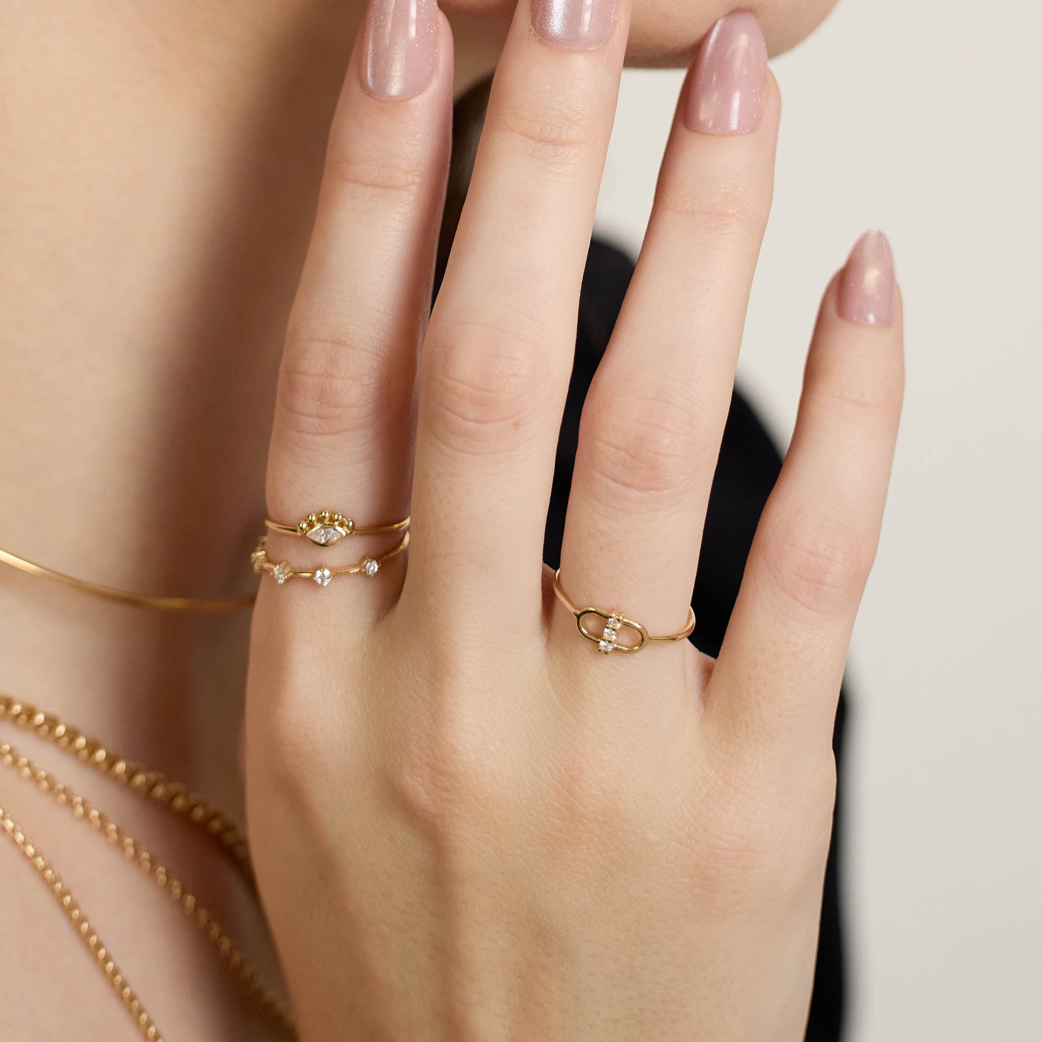 Zoe Chicco 14K gold rings with a neutral background