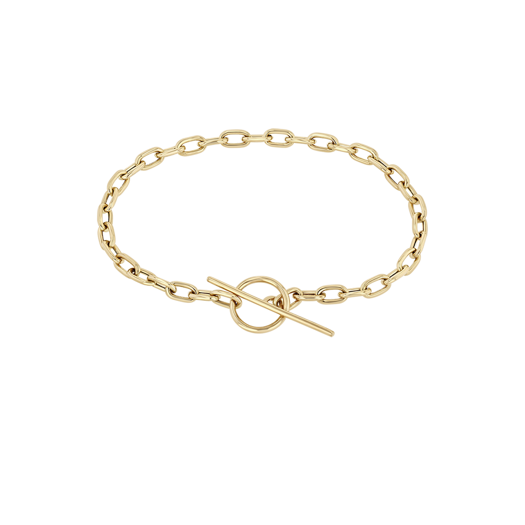 Zoe Chicco 14k gold large oval chain bracelet with a toggle clasp on a transparent background