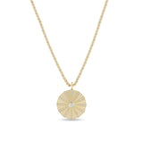Zoe Chicco 14k circular sunbeam pendant necklace with small diamonds on a white background