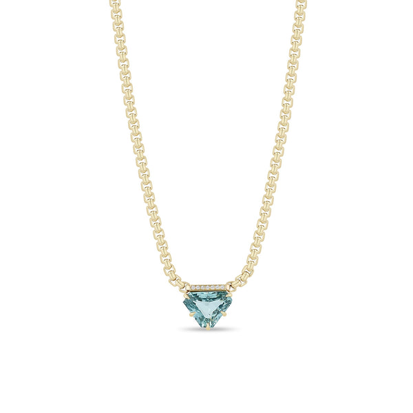Zoe Chicco 14K Gold chain necklace with a triangular shaped light blue sapphire gemstone with diamonds on a white background