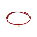 Zoe Chicco 14k gold red paracord bracelet with horseshoe charm on a white background