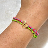 Zoë Chicco 14k Gold Midi Bitty Best Friends Heart Paracord Bracelet Set in Pink Blue and Neon Green Black stacked together on a wrist