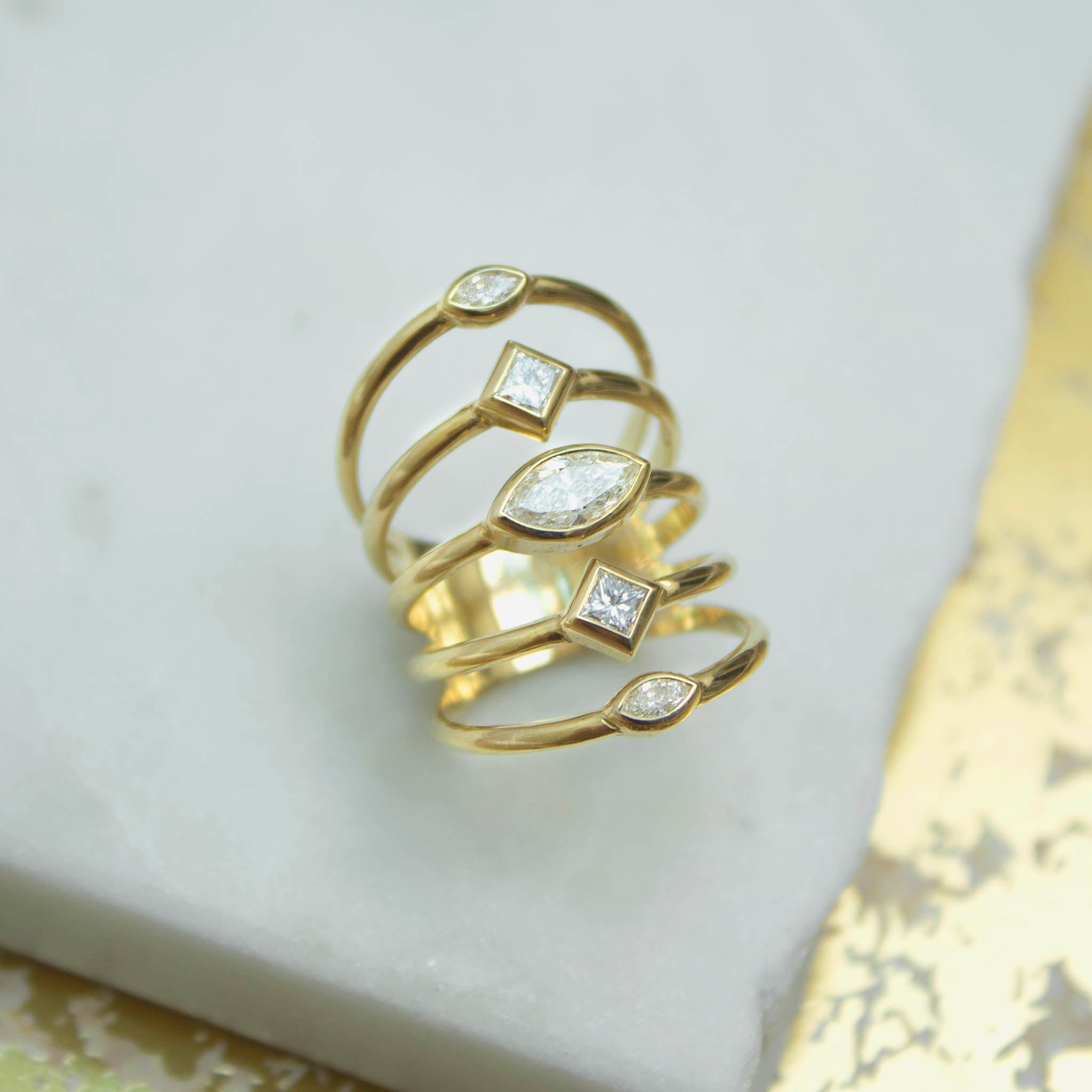 Zoe Chicco's 14k Marquise & Princess Diamonds 5 Band Ring on a white marble background