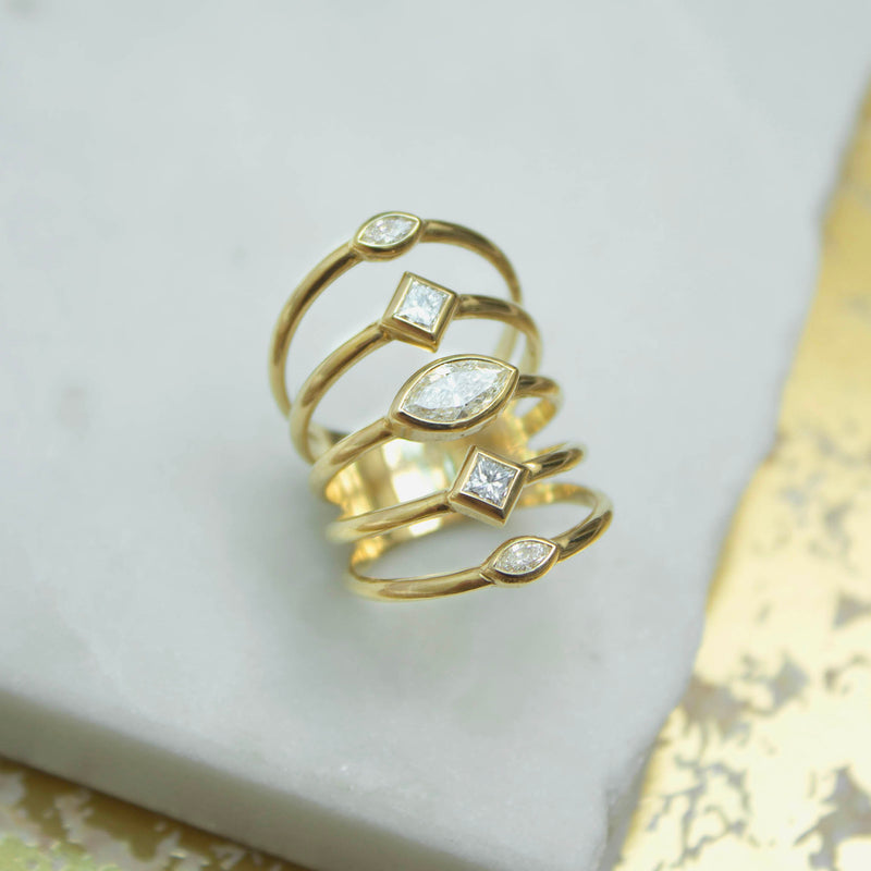Zoe Chicco's 14k Marquise & Princess Diamonds 5 Band Ring on a white marble background