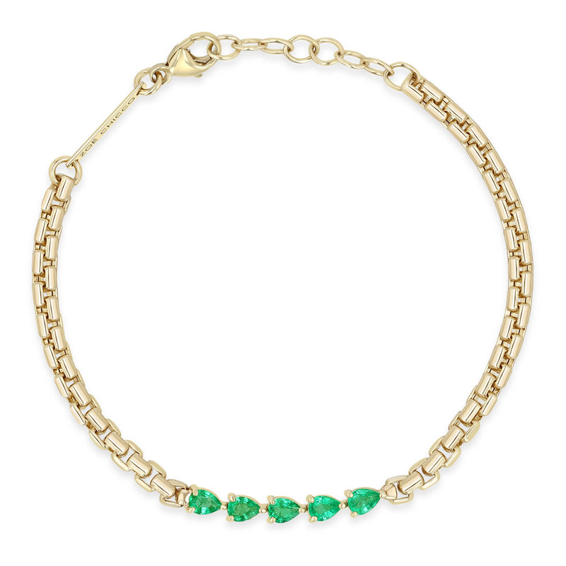 Zoe Chicco 14k gold chain bracelet with five emeralds linked together in the center on a white background